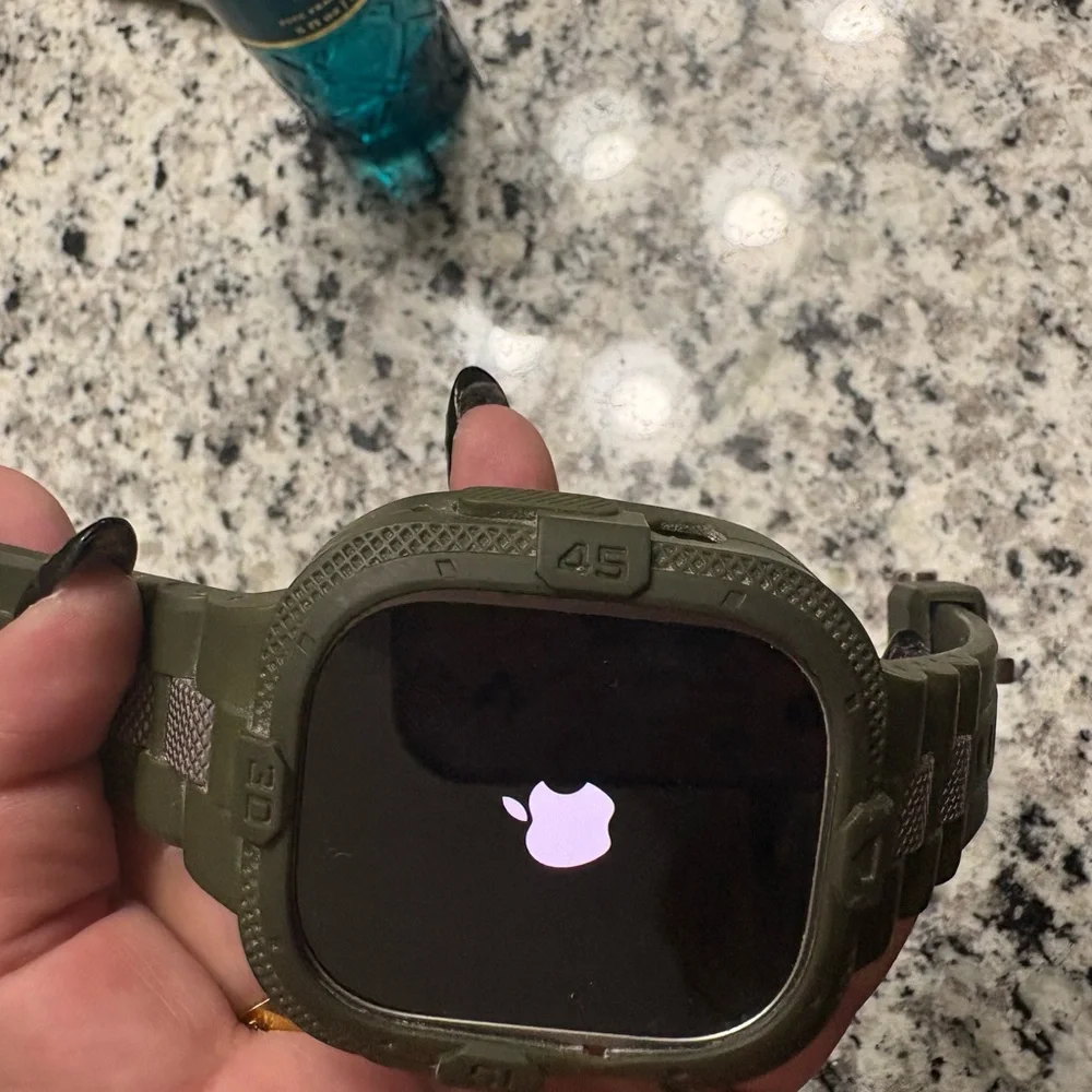 Apple Smartwatch with Black Face and Green Case